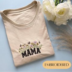 This adorable sweatshirt or tee is the perfect item for Mom's closet! A crewneck sweatshirt/tee with the word "Mama" hand-embroidered in a beautiful floral fabric! INCLUDES ♡one T-shirt or Crewneck color Sand -  If you require a different color message seller first RETURN POLICY ♡If your order is customized as requested, no refunds or exchanges will be offered. ♡If there was a mistake or misspelling please contact me so I can send a replacement free of charge. SHIPPING ♡All items are shipped usi Spring Tops With Letter Embroidery And Relaxed Fit, Relaxed Fit Tops With Letter Embroidery For Spring, Floral Embroidery Crew Neck Top As Gift, Custom Embroidered Tops As Spring Gift, Custom Embroidered Top For Gift In Spring, Relaxed Fit Top With Embroidered Text For Gift, Custom Embroidery Spring Tops As Gift, Spring Custom Embroidered Top As Gift, Cotton Tops With Embroidered Logo For Gift