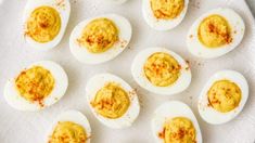 deviled eggs are arranged on a white plate