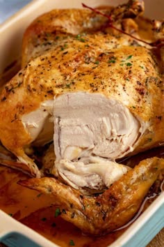 a close up of a chicken in a casserole with text overlay that reads perfect roast chicken the crispest skin ever - juicyest meat