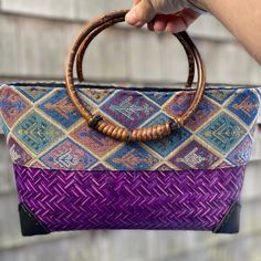 Handcrafted In India Handwoven Bamboo Straw Bottom Tapestry Cotton Fabric On Top Rattan Wood Handles Zippered Top Hand Sewn Faux Leather Corners Cotton Lined Inside With Zippered Pocket Brand New, Never Used Bohemian Bags With Bamboo Handle And Rectangular Shape, Purple Woven Shoulder Bag For Travel, Bohemian Rectangular Bag With Bamboo Handle, Traditional Purple Rectangular Shoulder Bag, Purple Handwoven Shoulder Bag For Daily Use, Purple Handwoven Bag For Everyday Use, Traditional Purple Rectangular Bag, Daily Use Purple Handwoven Shoulder Bag, Purple Handwoven Bags For Daily Use