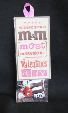 a valentine's day card with a pink ribbon on it