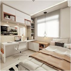 a bedroom with a bed, desk and computer