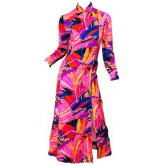 Amazing vintage early 1970s DYNASTY for I. MAGNIN psychedelic print silk cheongsam / maxi dress! Dynasty, a very sought after label in the 60s and 70s were known for their quality silk and Asian influenced designs. This rare gem features vibrant neon colors of pink, fuchsia, purple, orange, red, yellow, blue, black and white. Tailored bodice with hidden metal zipper up the side. Fabric covered toggle buttons by the color with hidden snaps and hook-and-eye closures. Can easily be worn day or even 70s Mode, New Look Dresses, Honey Shop, Beaded Maxi Dress, 70s Maxi Dress, Bolero Dress, 1970s Dresses, Couture Vintage, 1970s Fashion