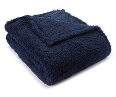 a dark blue blanket folded on top of each other