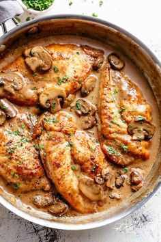 chicken with mushrooms and sauce in a pan