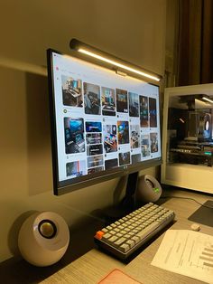 a desktop computer monitor sitting on top of a desk next to a keyboard and mouse