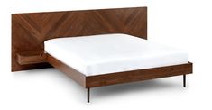 a bed with wooden headboard and white sheets