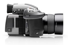 a black and white photo of a camera with the lens attached to it's body