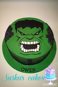 a green cake with an angry face on it