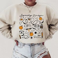 a woman in ripped shorts and a sweatshirt with the words spread wings on it's chest