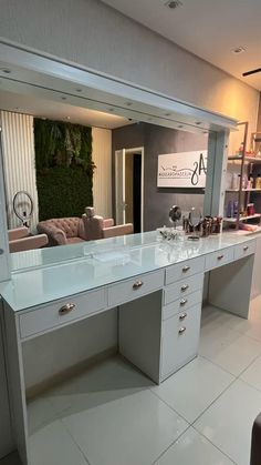 a large white desk with lots of drawers