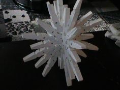 a paper snowflake sitting on top of a table