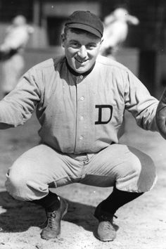 an old black and white photo of a baseball player