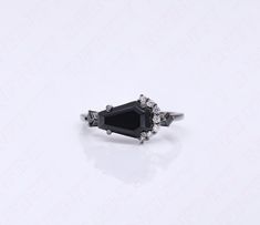 Ring Specifications & Details: Engagement/Wedding/Bridal Ring Stone Size: 10.00X7.00 mm Accents: Black Spinal Gemstone Stone Type: Black Onyx Gemstone Stone: Coffin Shape Natural Black Onyx Gemstone Metal Used: 925 Sterling Silver For Matching Necklace visit: https://www.etsy.com/uk/listing/1557979504/sterling-silver-black-rhodium-coffin?click_key=a40a886f48fe52aef024726931a465859a814427%3A1557979504&click_sum=75c445a1&ref=shop_home_active_1&pro=1 For Matching Earrings Visit: https://www.etsy.co Black Formal Jewelry With Accent Stones, Black Sterling Silver Crystal Ring For Wedding, Black Open Ring Crystal Wedding Ring, Black Crystal Open Ring For Weddings, Black Open Crystal Ring For Wedding, Black Open Ring For Wedding, Boho Graduation, Gothic Boho, Silver Engagement Ring