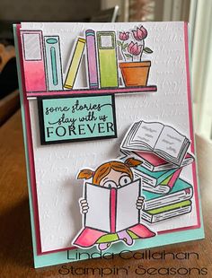 a card with a girl reading a book and holding a flower in front of bookshelves