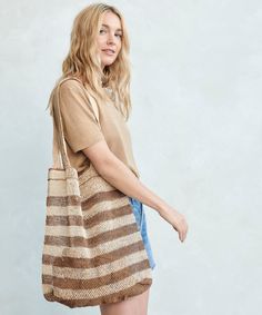 Natural Lao Vine Tote Natural Stripe This versatile and eco-friendly bag is perfect for beach days, grocery runs, and beyond. A completely natural product handcrafted from 100% kudzu vine fiber that grows wildly in northern Laos without any cultivation, irrigation or chemicals. Handcrafted from 100% kudzu vine fiber. Zero waste, organic, vegan, plastic-free, chemical-free, and Fair Trade. Due to the handmade nature of this bag, product may slightly vary as each one is unique. Please note that th Brown Fair Trade Shoulder Bag For Beach, Fair Trade Straw Bag For Market In Summer, Beige Fair Trade Straw Bag For Everyday Use, Fair Trade Straw Bag For Summer Market, Summer Fair Trade Straw Bag For Market, Summer Brown Fair Trade Shoulder Bag, Fair Trade Natural Beach Bag For Summer, Fair Trade Summer Tote Straw Bag, Summer Rectangular Fair Trade Shoulder Bag