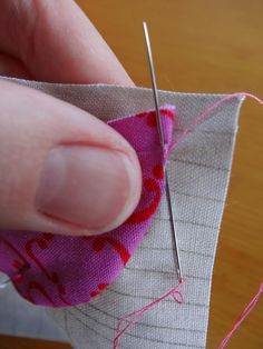 the needle is being used to sew on fabric