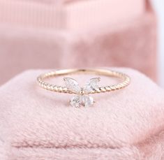 Butterfly Mood Ring, Butterfly Wedding Ring, Butterfly Diamond Ring, Cute Promise Rings, Dainty Stackable Rings, James Avery Butterfly Rings ✧･ﾟ: *✧･ﾟ:* Welcome to Charles Davin Jewelry*:･ﾟ･ﾟ✧ Moissanite - a gemstone known to bring in luck in someone's life, the user can give off a look of elegance. You can give your special someone luck whilst showing your love to them. ✶Material: 10K/ 14K/ 18K ✶Main Stone: Marquise Cut Moissanite; Total: 0.25ct ✶Side Stone: - ✶Color: D Colorless ✶Clarity: VVS1 Promise Rings Butterfly, Butterfly Wedding Ring, Dainty Butterfly Ring For Wedding, Minimalist Butterfly Ring For Wedding, Elegant Butterfly Wedding Ring, Dainty Diamond Butterfly Promise Ring, Unique Butterfly Ring For Wedding, Butterfly Diamond Ring, Butterfly Engagement Ring