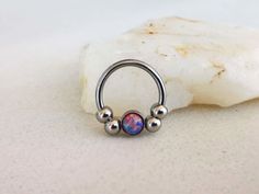 "Silver Septum Clicker or Daith Earring Ring with Purple Opal Stone 📯 SPECIAL OFFER: If you order this Purple Opal septum ring, together with either Blue or White, you will get 3rd one as a gift! 🎁 Blue: https://www.etsy.com/listing/793235153/silver-septum-clicker-daith-earring-ring White: https://www.etsy.com/listing/778769232/silver-septum-clicker-daith-earring-ring HOW YOU CAN WEAR IT? ❖ daith captive bead ring ❖ septum captive bead ring ❖ septum horseshoe ❖ septum retainer DIMENSIONS ❖ 16 Hide Piercings, Septum Retainer, Opal Septum, Daith Earring, Daith Jewelry, Purple Opal, Circular Barbell, Daith Earrings, Rose Gold Earrings Studs