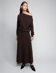 Chocolate brown maxi full skirt with elastic waistband . Styled with matching off-the-shoulder knit top. 50% wool, 50% polyesterElastic encased waistband Total length 39.5"Model is wearing a size S and model’s height is 5.9”Imported Crop Sweater Maxi Skirt, Black Maxi Skirt With Sweater Pregnancy, Maxi Skirt Winter 2022, One Shoulder Knit Top, Brown Maxi Skirt, Maxi Skirt Winter, Brown Maxi Skirts, Skirt With Elastic Waistband, Full Maxi Skirt