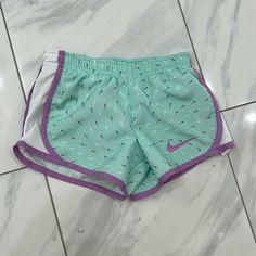 Toddler Nike Dri-Fit Shorts Size Xs/4 For 3-4 Years Lined. Purple And White Nike Swoosh. Nwot. Playful White Shorts, Playful Nike Cotton Bottoms, Playful Green Sports Shorts, Playful Cotton Bottoms By Nike, White Shorts With Built-in Shorts For Playwear, White Playwear Shorts, Playful White Bottoms With Built-in Shorts, Nike Summer Shorts For Playwear, Nike Shorts For Summer Playwear