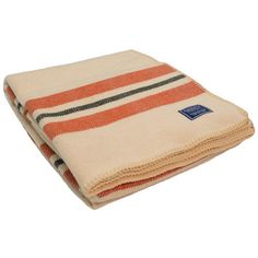 an orange and white striped towel folded on top of each other with a blue tag