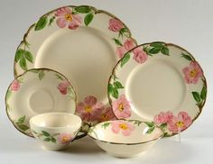 a white plate with pink flowers on it