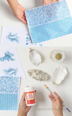 someone is painting some blue and white paper on the table with their handmade items