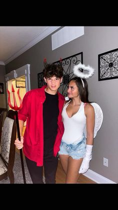 two people in costumes standing next to each other