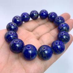 This Listing Is For Lapis Lazuli, The Photos Are Taken In Studio And Color Is Not Enhanced, If You Want Us To Take Photos In Natural Light Please Ask Before Purchase. DESCRIPTION: HAND MADE IN AFGHANISTAN BEST GIFT FOR FAMILY & FRIENDS SPECIFICATION: GEMSTONE TYPE:    Lapis Lazuli WEIGHT:                    98 Grams COLOR:                     Blue SIZE:                           16-17 mm Beads In Bracelet ORIGIN:                     Afghanistan QUANTITY:                One FINISH: Lapis Lazuli Beads With Natural Stones, Round Lapis Lazuli Beads With Natural Stones, Polished Beads Lapis Lazuli Round Bracelets, Polished Beads Lapis Lazuli Bracelets, Round Lapis Lazuli Bracelets With Polished Beads, Lapis Lazuli Beaded Bracelets With Polished Round Beads, Gift Lapis Lazuli Beaded Bracelets With Polished Beads, Spiritual Lapis Lazuli Round Beads, Lapis Lazuli Gemstone Beaded Bracelets