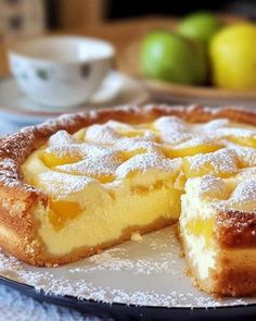 a lemon pie on a plate with one slice cut out