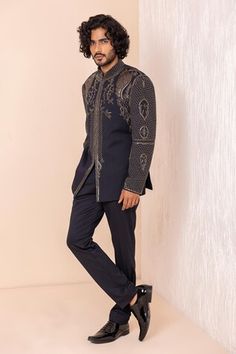 Navy blue full sleeves jodhpuri bandhgala with metal Crest embroidery. Paired with a pant. - Aza Fashions Bollywood Style Bandhgala With Gota Work, Formal Long Sleeve Kurta With Gota Work, Ceremonial Sherwani With Gota Work And Long Sleeves, Ceremonial Long Sleeve Sherwani With Gota Work, Long Sleeve Sherwani With Gota Work For Ceremonial Occasions, Traditional Winter Kurta For Reception, Fitted Long Sleeve Sherwani With Gota Work, Bollywood Style Ceremonial Bandhgala With Gota Work, Designer Sherwani With Gota Work