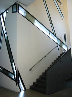 the stairs are made of glass and have been designed to look like an abstract piece of art