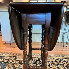 an antique wooden table with two legs