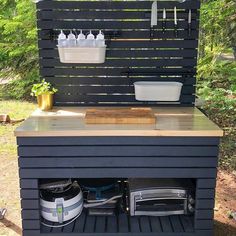 an outdoor kitchen built into the side of a house