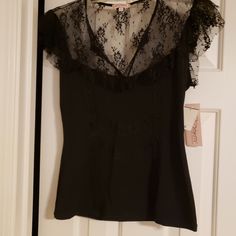 This Is A Ladies Large Little Black Top. It Has A V-Neck With Lace. It Is By Six Degrees Of Separation. It Runs A Little Small On The Length. It Is Brand New With Tags. It Is Made Of 60% Polyester, 35% Rayon And 5% Spandex. It Comes From A Clean And Smoke Free Home. Fitted Black V-neck Blouse, Stretch Lace Trim Tops For Date Night, Casual V-neck Lace Top For Party, Black Fitted V-neck Blouse, Black V-neck Blouse With Lace Trim, Black Lace Trim Top For Night Out, Black Lace Trim Top For Date Night, Evening V-neck Top With Lace Trim, V-neck Lace Trim Top For Night Out