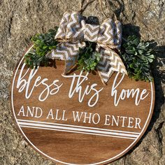 a wooden sign that says, bess this home and all who enter