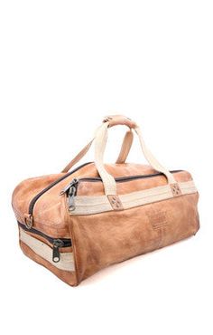 Designed with the traveler in mind, RUSLAN can be carried on a plane, in hand or as a backpack. Durable canvas straps carry this beautiful leather duffle, with plenty of room for all your necessities. 3 outer zip pockets make finding everything quick and simple, and the zip top main compartment is lined with organic cotton and has 2 slip pockets and one zippered pocket inside. Carry yourself confidently with RUSLAN, a handsome bag made for anyone.Chrome and formaldehyde free, vegetable tanned le Travel Duffle Bag, Leather Duffle Bag, Leather Duffle, Travel Duffle, Duffle Bag Travel, A Plane, Zip Top, Travel Bags, Bag Making