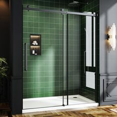 a green tiled bathroom with a walk in shower