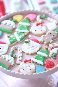 decorated christmas cookies in a pink tray