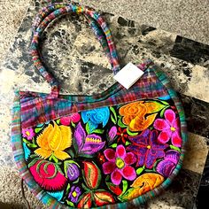 This Gorgeous Bag Has Vibrant Floral Design On Front. The Back Is Plaid With Two Zippered Pockets . Measures 14x10 Approximately With A 9”Strap Drop . Inside Is Silky Nylon With A Large Zipper Pocket. Casual Multicolor Embroidery Bags, Casual Multicolor Embroidered Shoulder Bag, Casual Multicolor Embroidered Bag, Casual Red Embroidered Shoulder Bag, Embroidered Purse, Creative Sewing, Gorgeous Bags, Ribbon Embroidery, Hand Embroidered