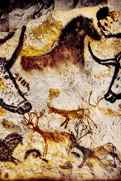 an image of some animals and people on a cave wall in the desert, painted with rock art