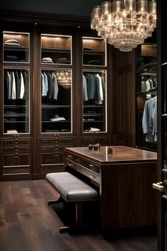 a walk in closet with lots of clothes