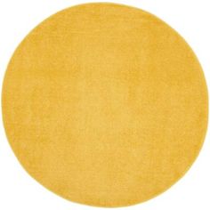 a round yellow rug on a white background