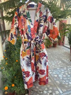 This Kimono is made of hand Kantha stitch fabric in patchwork .The fabric is a handmade printed fabric.Kantha stitch over the fabric gives it a unique look.It is two Layer of Cotton Kantha Stitch (Hand Quilted) Fabric Robe Size : Free sizeLength: 50 Inch ( 125 Cms.).Note: Due to patchwork theme there may be little difference in patches and color combination. Multicolor Summer Robe For Home Use, Fitted Long Sleepwear For Summer, Long Summer Party Robe, Summer Party Robe With V-neck, Summer Party V-neck Robe, Fitted Multicolor Kimono For Vacation, Long Floral Print Summer Sleepwear, Fitted Multicolor Sleepwear For Vacation, Fitted Summer Sleep Robe