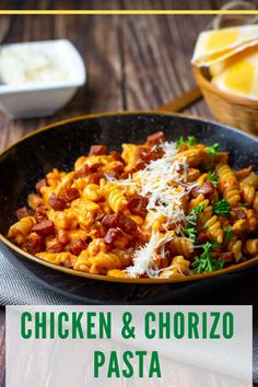 chicken and chorizo pasta in a skillet with parmesan cheese