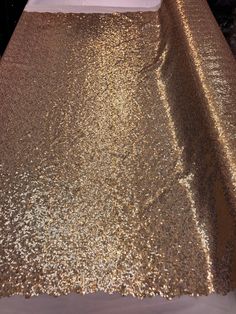 the table is covered with gold sequins