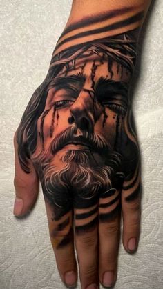 Tattoed Hands Man, Religious Hand Tattoo, Nice Hand Tattoos, Fist Tattoo Ideas For Men, Jesus Tatoos Ideas, Jesus Tattoo Men, God Hands Tattoo, Hand Tats Men, Angel Hand Tattoo