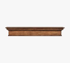 a wooden shelf on a white background