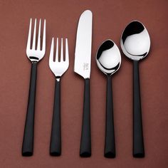 five forks, two spoons and one knife on a brown surface